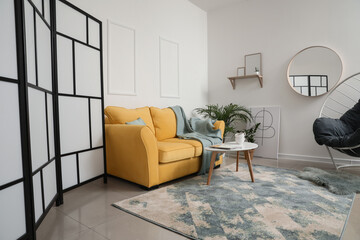 Interior of modern room with cozy sofa
