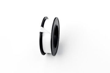 Naklejka premium Pipe thread seal tape isolated on white background.
