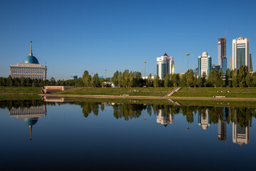 Fototapeta na wymiar View from the right embankment of Ishim river facing the Ak Orda Presidential Palace in Nur-Sultan, the capital of Kazakhstan.