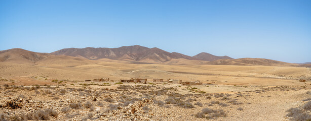 Panoramic view on a desert landscape somewhere in the central part of the Fuerteventura island. Canary Islands. Spain.
