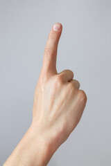 Man hand shows the number one. Countdown gesture or sign. Sign language.
