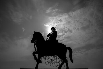 black and white picture of a statue of raja surajmal with sunstar sitting on horse
