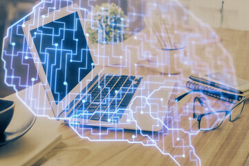 Double exposure of desktop with computer and brain drawing hologram. Artificial intelligence concept.
