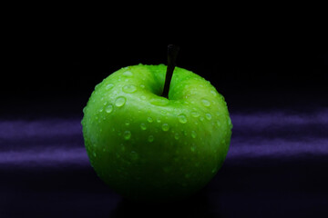 Green Apple in water drops