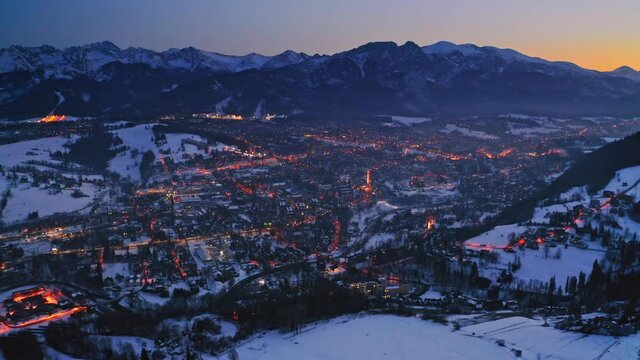 Stunning dusk over zakopane city in winter, aerial view