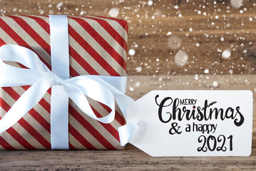 Fototapeta na wymiar Christmas Present, Label, Merry Christmas And A Happy 2021, Snowflakes