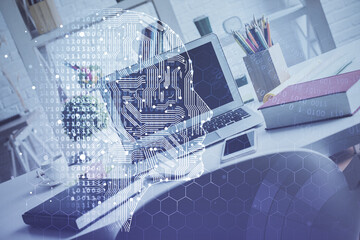 Double exposure of work space with computer and human brain drawing hologram. Brainstorm concept.