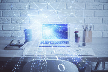 Double exposure of desktop computer and technology theme hologram. Concept of software development.