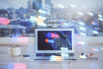 Double exposure of desktop computer and technology theme hologram. Concept of software development.