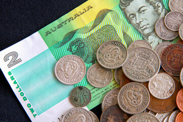 Old Australian money: coins and a two dollar note.