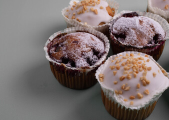 yummy sweet tasty muffin cakes on simple mono color background