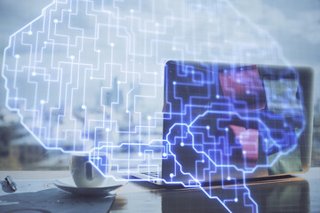 Multi exposure of work space with computer and human brain hologram. Brainstorm concept.