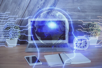 Multi exposure of work table with computer and brain hologram. Brainstorm concept.