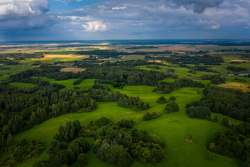 Fototapeta na wymiar Beautiful aerial view of the countryside with green meadows and trees