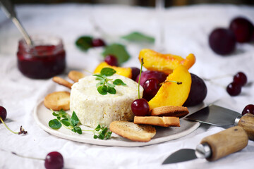 Farmer camembert cheese on the cutting board. selective focus