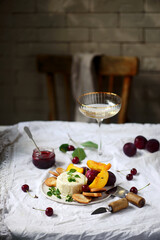 Farmer camembert cheese on the cutting board. selective focus