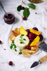 Farmer camembert cheese on the cutting board. selective focus