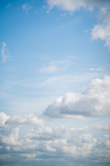 white cumulus clouds in the blue sky