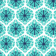 Abstract seamless vector ornament of snowflake shapes in pastel winter colors