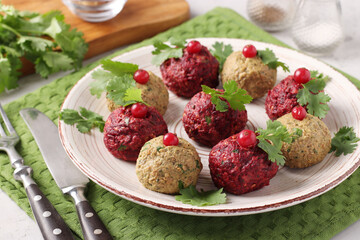 Traditional Georgian appetizer pkhali from beets and eggplants on light gray background, Closeup