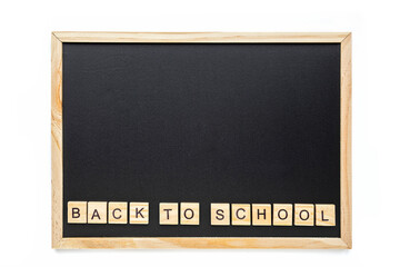 Back to school words lettering on the school black chalkboard. Education, back to school concept, top view, flat lay.