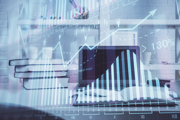 Stock market graph and table with computer background. Multi exposure. Concept of financial analysis.