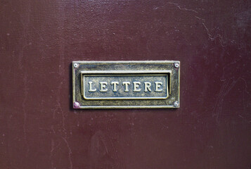 Old letterbox in the door, traditional way of delivering letters to the house, old mailbox,...
