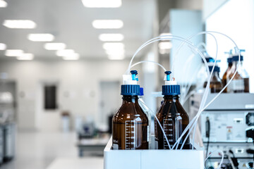 chemistry research center. lab shallow DOF focus on the glassware in the foreground. Laboratory research concept