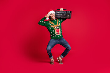 Full length body size view of attractive glad crazy ecstatic cheerful cheery guy wearing Santa hat...