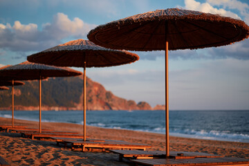 Beautiful landscape. Traveling by Turkey. Sea Beach with sunloungers and umbrellas.