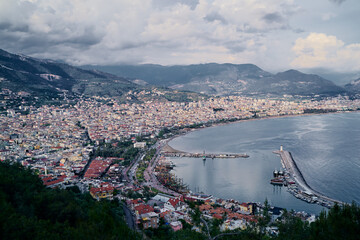 Beautiful view of Alanya city with mountains and sea bay.