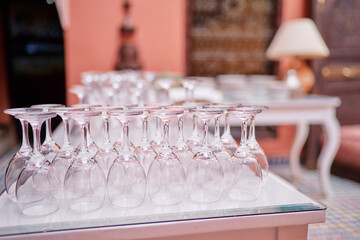 Wineglasses set on white table.