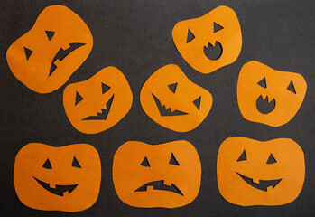 Orange funny pumpkins on a black background.The Concept Of Halloween