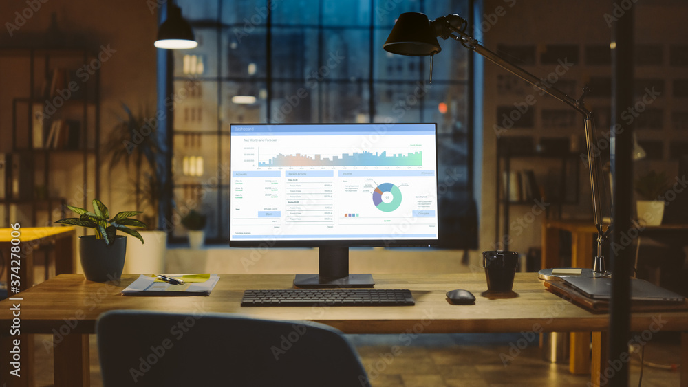 Aufkleber Shot of a Desktop Computer with Statistics Graph, Chart and Various Data, Showing Company Growth and Success. In the Background Warm Evening Lighting and Open Space Studio with City Window View.
