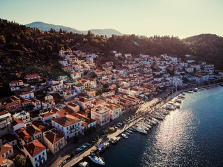 Scenic view of Poros island in a typical summer day. Old town with traditional white houses near the sea. Saronic gulf, Greece, Europe.