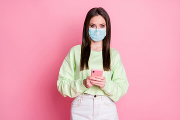 Portrait of her she attractive lovely pretty girl wearing safety gauze mask using device stay home...