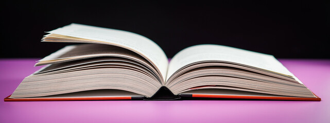 Banner open book on the table. It is time for education and therefore you need to go back to school.