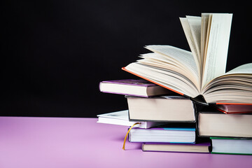 Open book on the table. It is time for education and therefore you need to go back to school.