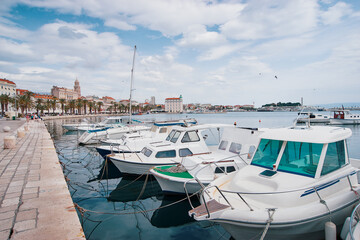 Fototapeta premium Travel by Croatia. Beautiful landscape with Split Old Town on sea shore. Boats at the harbour.