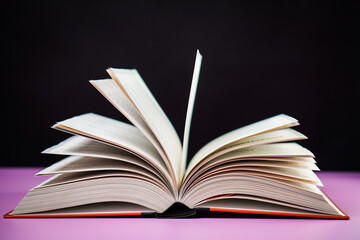 Open book on the table. It is time for education and therefore you need to go back to school.
