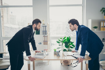 Profile side view portrait of two nice attractive handsome confident serious focused men lawyer...