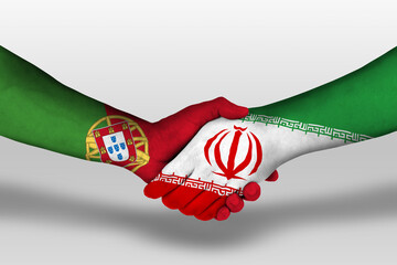 Handshake between iran and portugal flags painted on hands, illustration with clipping path.