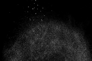 Abstract splashes of water on black background. Freeze motion of white particles. Rain, snow overlay texture.