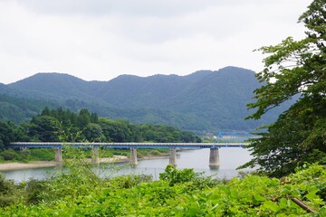 Obraz na płótnie Canvas 大倉ダムにかかる青い橋/The blue bridge over the Okura dam in Miyagi, Japan