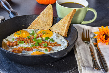 fried eggs with bacon and toast
