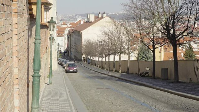 Empty Prague street with descending road without people during the coronavirus pandemic