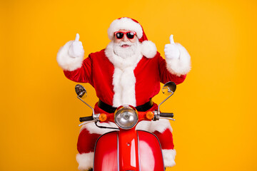 Portrait of his he nice cool funny cheerful cheery Santa riding moped showing double thumbup discount winter isolated bright vivid shine vibrant yellow color background