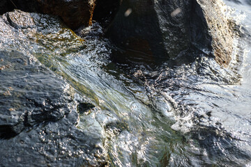 Wave on the stone beach background.