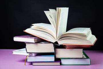 Open book on the table. It is time for education and therefore you need to go back to school.