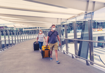 Son and Senior mother at the airport traveling back home worried of coronavirus quarantine and infection